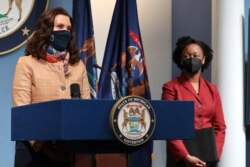 Governor Gretchen Whitmer addresses the state as Michigan Department of Health and Human Services Chief Medical Executive Dr. Joneigh Khaldun, right, listens, April 9, 2021, in Lansing. (Michigan Office of the Governor)