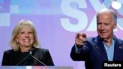 Jill Biden (L) introduces her husband, former U.S. Vice-President Joe Biden, to speak about the Biden Cancer Initiative at the South by Southwest (SXSW) Music Film Interactive Festival 2017 in Austin, Texas, March 12, 2017. 