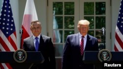 Los presidentes Trump, a la derecha, y Duda durante una rueda de prensa conjunta celebrada en la Casa Blanca, el 12 de junio de 2019.