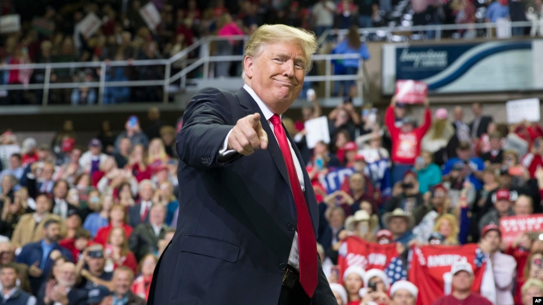 FILE - President Donald Trump points to a supporter as he departs a rally at the Mississippi Coast Coliseum in Biloxi, Miss., Nov. 26, 2018. Trump’s campaign has launched a state-by-state effort to prevent an intraparty fight. 
