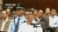 Former police chief Wang Lijun speaks during a court hearing in Chengdu in this still image taken from video September 18, 2012. 