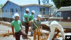 Students in the Eagle Nest Construction Academy work on the foundation of a home which will house a low-income family next year.