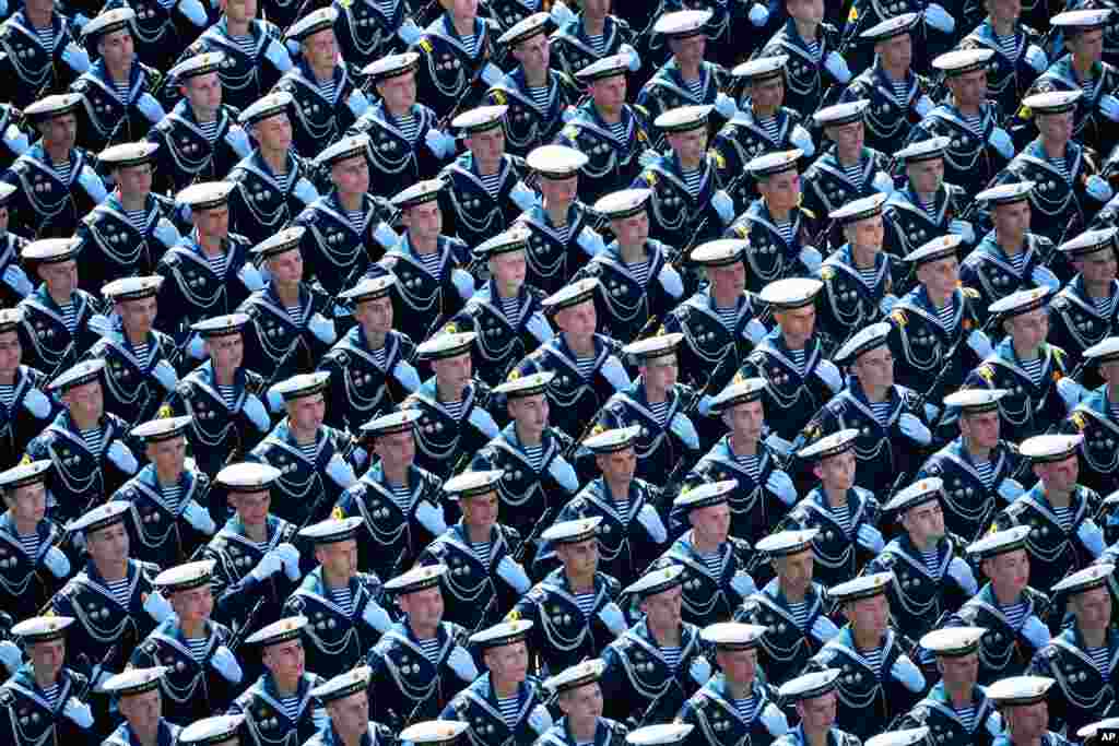 Russian sailors march toward Red Square during the Victory Day military parade marking the 75th anniversary of the Nazi defeat in Moscow, Russia.