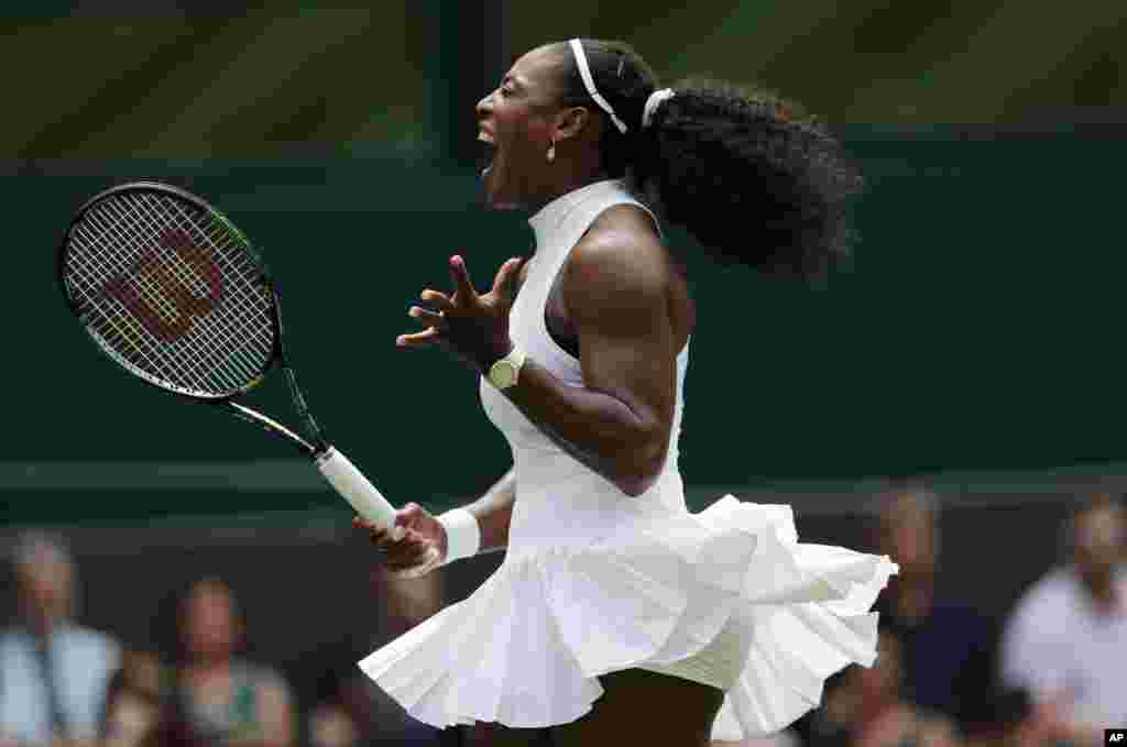 Serena Williams of the U.S celebrates a point against Amara Safikovic of Switzerland during their women&#39;s singles match on day two of the Wimbledon Tennis Championships in London.