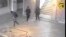 FILE - In this frame made from CCTV and released by the Tunisian government, two gunmen and third unidentified man can be seen inside the Bardo museum in Tunis, March 18, 2015. 