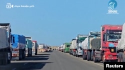 Hundreds of trucks wait on the Egyptian side of the Gaza border in this still image from social media video, released Feb. 18, 2024. (Sinai Foundation for Human Rights via Reuters)