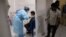 A health worker administers the vaccine for COVID-19 in Mumbai, India, Aug. 19, 2021.