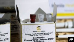 A newly developed SARS CoV-2 detection kit by University of the Philippines scientists is shown during a press conference in Quezon, Philippines, March 12, 2020.
