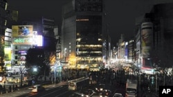 Advertising boards on the buildings are seen without the illumination at Tokyo's Shibuya district, March 14, 2011