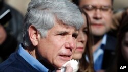 Former Illinois Gov. Rod Blagojevich dabs blood from his chin during a news conference outside his home, Feb. 19, 2020, in Chicago. Blagojevich joked that it was the first time in a long time he has shaved with a normal razor. 