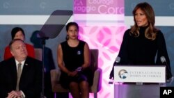 First lady Melania Trump speaks during the 2020 International Women of Courage Awards Ceremony at the State Department in Washington, Feb. 4, 2020, as Secretary of State Mike Pompeo, seated left, looks on. 