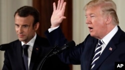 President Donald Trump speaks during a news conference with French President Emmanuel Macron in the East Room of the White House, April 24, 2018, in Washington. 