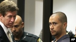 Attorney Mark O'Mara (L) looks on George Zimmerman (R) makes his first appearance on second degree murder charges in the shooting death of Trayvon Martin in courtroom J2 at the Seminole County Correctional Facility in Sanford, April 12, 2012. 