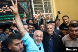 Iranian presidential candidate Masoud Pezeshkian waves at the crowd during the runoff presidential election in Tehran on July 5, 2024. (West Asia News Agency via Reuters)