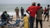 Family members, friends and community members gather along the beach as they wait for search and rescue teams to find survivors and retrieve the dead after a boat carrying migrants sunk off Mbour, Senegal, on Sept. 9, 2024. 