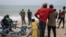 Family members, friends and community members gather along the beach as they wait for search and rescue teams to find survivors and retrieve the dead after a boat carrying migrants sunk off Mbour, Senegal, on Sept. 9, 2024. 