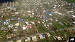 FILE - An aerial view of St. Croix from Air Force 2, as Vice President Mike Pence, his wife Karen Pence and Virgin Islands Del. Stacey Plaskett, D-At Large, fly in to Henry E. Rohlsen Airport in Frederiksted, U.S. Virgin Islands for an update on recovery efforts, Oct. 6, 2017. 