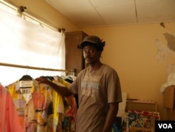 Multimedia artist Sel Kofiga turns fabrics from Kantamanto market into upcycled clothes under the name The Slum Studio, in Accra, Ghana, Sept. 22, 2020. (Stacey Knott/VOA)