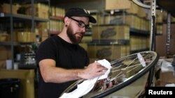 Gabe Ortiz services one of the company's products at State Bicycle in Tempe, Arizona, U.S. January 10, 2020. Picture taken January 10, 2020. REUTERS/ Caitlin O’Hara