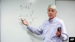 FILE - Teacher Jerry Howland explains an equation during the Bridge to Calculus summer program at Northeastern University in Boston on Tuesday, Aug. 1, 2023. (AP Photo/Reba Saldanha)