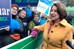 FILE - Democratic presidential candidate Sen. Amy Klobuchar greets supporters in Manchester, N.H., Feb. 11, 2020.