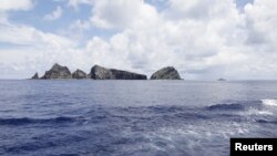 A group of disputed islands known as Senkaku in Japan and Diaoyu in China is seen from the city government of Tokyo's survey vessel in the East China Sea, September 2, 2012.