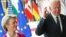 U.S. President Joe Biden crosses his fingers next to European Commission President Ursula von der Leyen as they attend the EU-US summit, in Brussels, Belgium June 15, 2021. REUTERS/Yves Herman