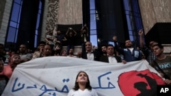 A girl chants slogans during a protest to mark World Press Freedom Day in front of the Press Syndicate in Cairo, Egypt, Tuesday, May 3, 2016.