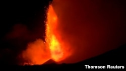 Spectacular eruptions from Mount Etna light up the sky during the night in this still image taken from video filmed in Nicolosi, Catania, Italy, Dec. 14, 2020.