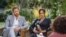 This undated image released March 7, 2021, courtesy of Harpo Productions shows Britain's Prince Harry and his wife, Meghan, Duchess of Sussex, in a conversation with US television host Oprah Winfrey. 