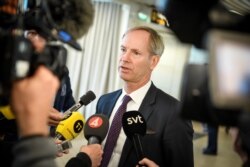 FILE - Sweden's ambassador to the United Nations Olof Skoog speaks to journalists during a news conference at Malmo airport, in Malmo, Sweden, April 22, 2018.