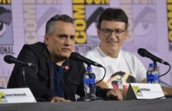 Joe Russo, left, and Anthony Russo participate in a conversation with the Russo Brothers on day two of Comic-Con International, July 19, 2019, in San Diego.
