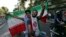 Iranians attend a street celebration in Tehran, after their national soccer team qualified for the 2014 World Cup by defeating South Korea, June 18, 2013. 