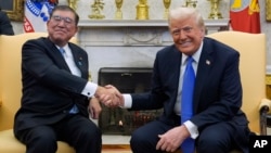 U.S. President Donald Trump meets with Japanese Prime Minister Shigeru Ishiba in the Oval Office of the White House, Feb. 7, 2025, in Washington. 