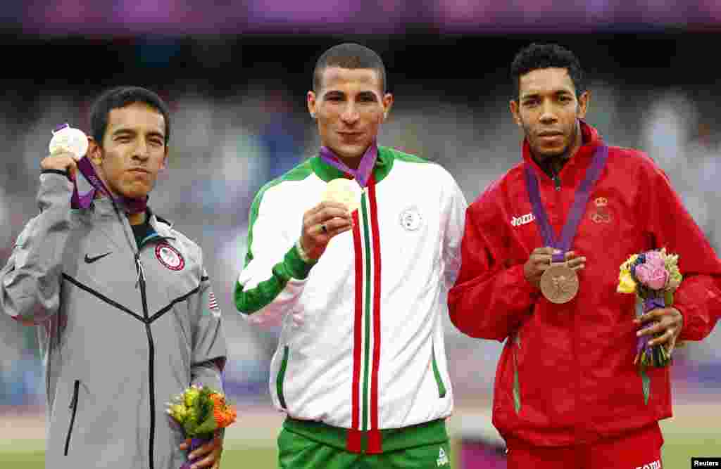 The medalists in men's 1500m (L-R) Algeria's Taoufik Makhloufi with gold (C), Leonel Manzano (L) of U.S. with silver and Morocco's Abdalaati Iguider with bronze