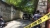 Journalists stand by a yellow police cordon near the residence of Haiti's President Jovenel Moise after he was shot dead by unidentified attackers, in Port-au-Prince, Haiti, July 7, 2021.