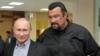 Russia -- President Vladimir Putin and American action movie actor Steven Seagal visit a newly-built sports complex of Sambo-70 prominent wrestling school in Moscow, March 13, 2013