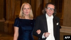 FILE - Swedish Academy member Katarina Frostenson and her husband Jean-Claude Arnault arriving for the Kings Nobel dinner at the Royal Palace in Stockholm, Dec. 11, 2011. 
