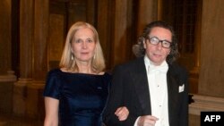 FILE - Swedish Academy member Katarina Frostenson and her husband Jean-Claude Arnault arriving for the Kings Nobel dinner at the Royal Palace in Stockholm, Dec. 11, 2011. 