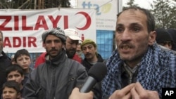 Syrian refugee Nizar Hajyousuf speaks in Yayladagi, Turkey about about violence in his Syrian hometown, Jisr Ash Shugur, Mar 12, 2012.