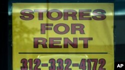 A stores for rent sign is displayed at an empty store in Buffalo Grove, Ill., July 15, 2021.