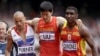 China's Liu Xiang leans against the last hurdle after crashing out of the heats in the 110 meter hurdles at the 2012 London Olympics. REUTERS/David Gray 