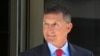 FILE - Former Trump national security adviser Michael Flynn leaves the federal courthouse in Washington, following a status hearing, July 10, 2018.