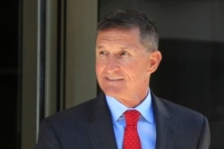 FILE - Former Trump national security adviser Michael Flynn leaves the federal courthouse in Washington, following a status hearing, July 10, 2018.