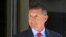 FILE - Former Trump national security adviser Michael Flynn leaves the federal courthouse in Washington, following a status hearing, July 10, 2018.