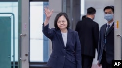 FILE - In this photo released by the Taiwan Presidential Office, Taiwan's President Tsai Ing-wen waves as she departs Taiwan, Sept. 5, 2023.