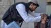 An Afghan health worker administers polio vaccine drops to a child during a polio vaccination campaign in Kandahar, Afghanistan, Jan. 27, 2025.