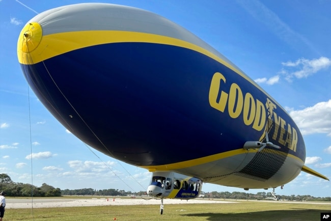 The Goodyear Blimp is prepared for takeoff, February 12, 2025, in New Smyrna Beach, Florida. (AP Photo/Mark Long)