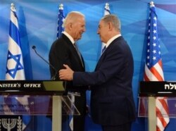 FILE - Then-U.S. Vice President Joe Biden and Israeli Prime Minister Benjamin Netanyahu shake hands while giving joint statements in the prime minister's office in Jerusalem, Israel, March 9, 2016. (Debbie Hill, Pool via AP)