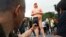 People take photos of a statue of a naked Republican presidential nominee Donald Trump in New York's Union Square, Aug. 18, 2016. City parks workers later removed the statue.